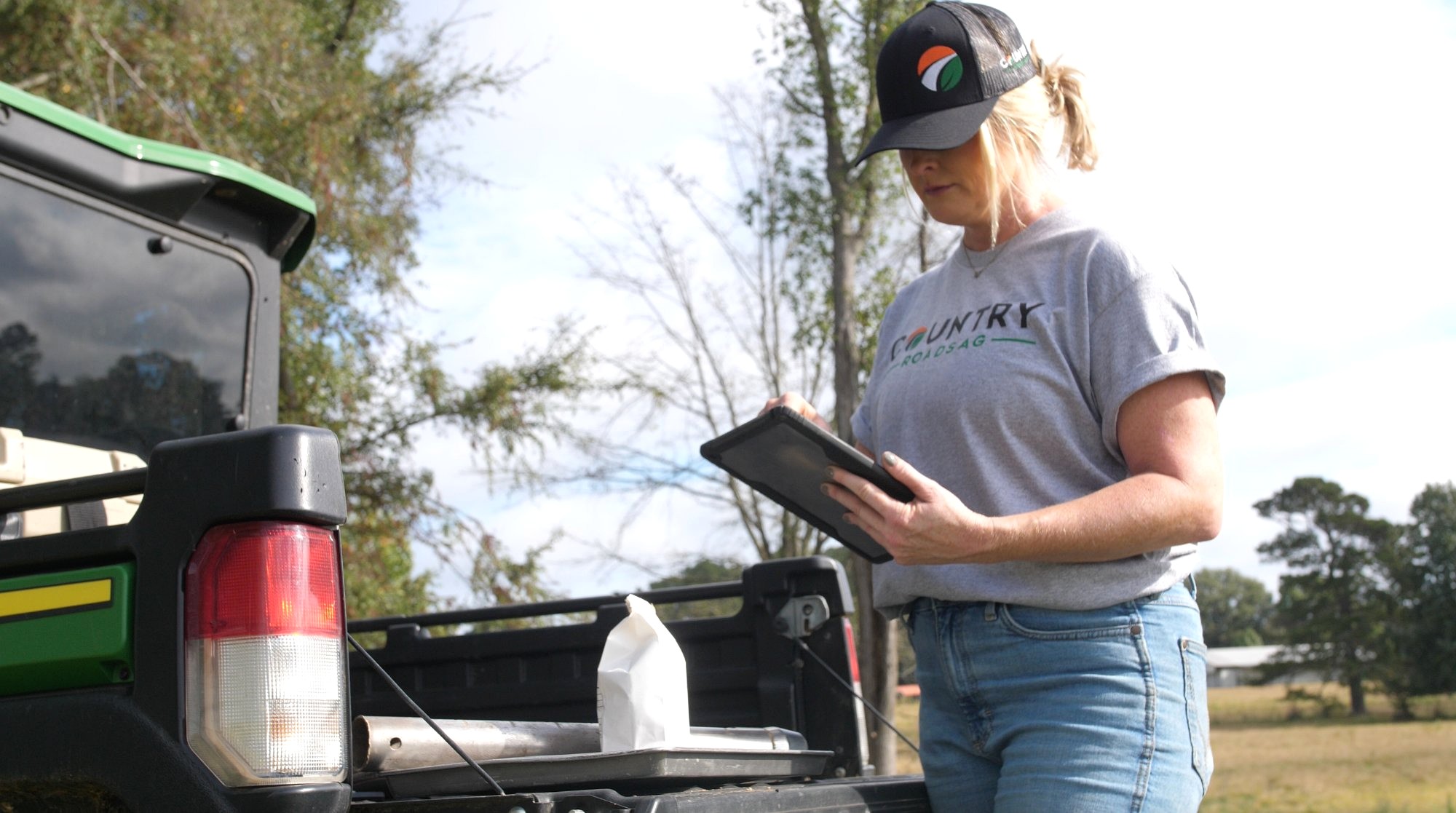 Country Roads Ag team member reviewing soil sampling data in the field